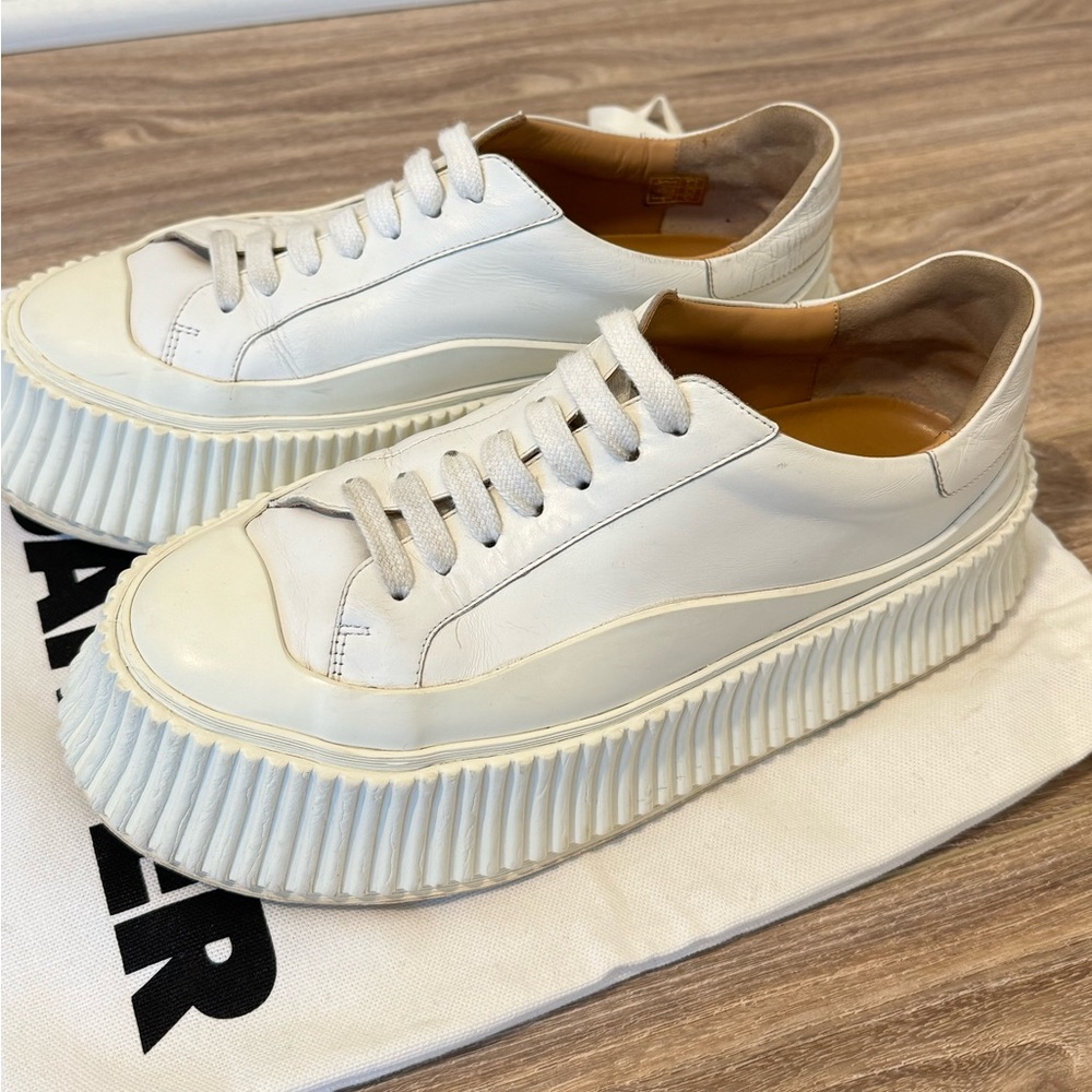 White Jil Sander platform sneakers in size 36 (6). Run a little big.